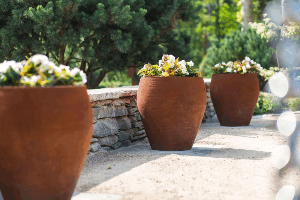 3 terracotta artisan garden pots by Torc pots by Gardens by Keltie & Clark